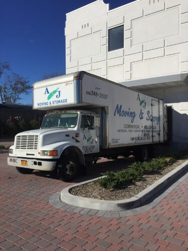 Franklin Square Commercial Moving Long Island with A & J Moving & Storage, Inc. Moving truck at storage facility.